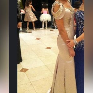 Elegant Party dress for women. Size  4-6US. The color is tan and sliver.